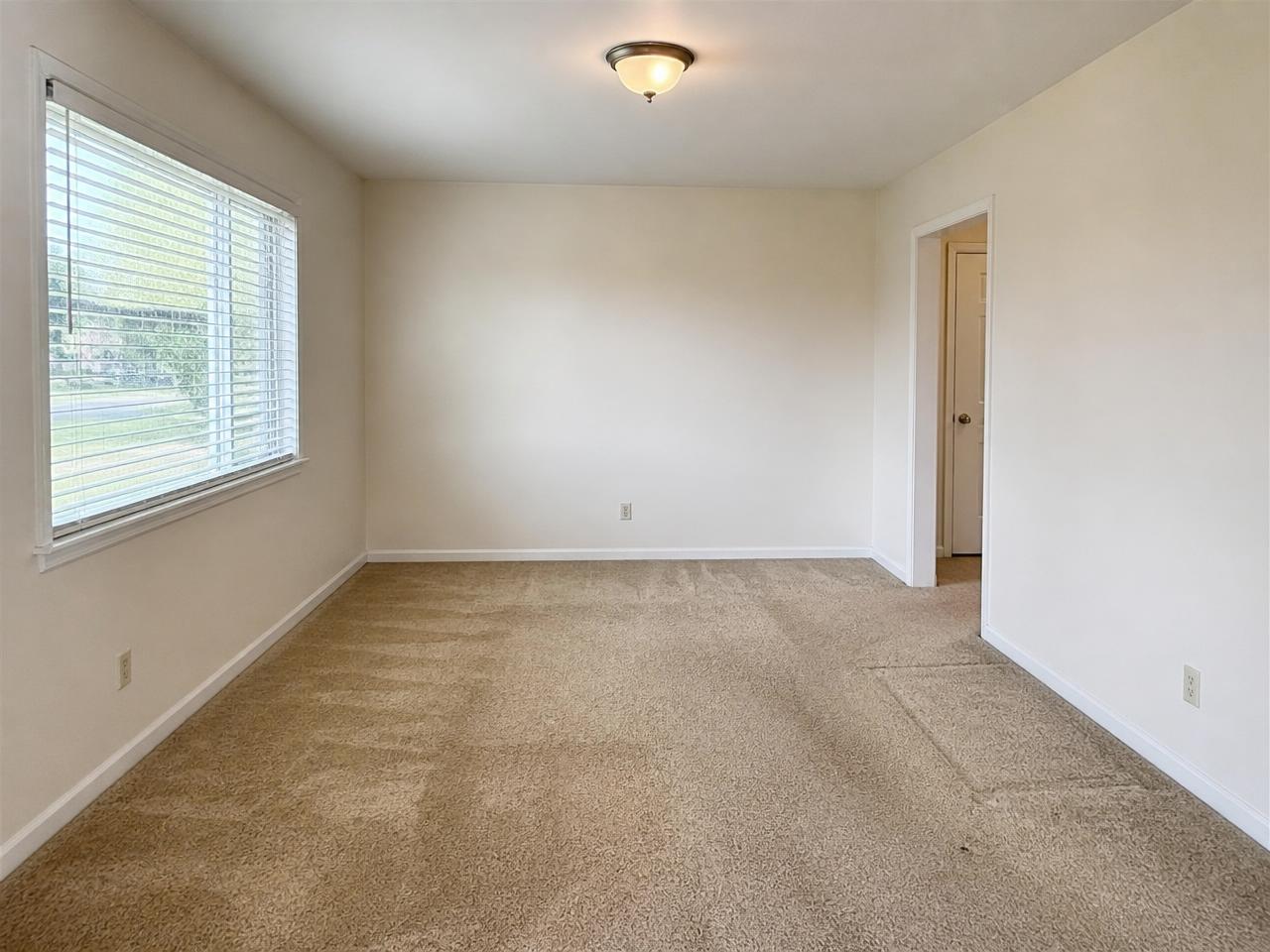 Uploaded room photo with the original carpet