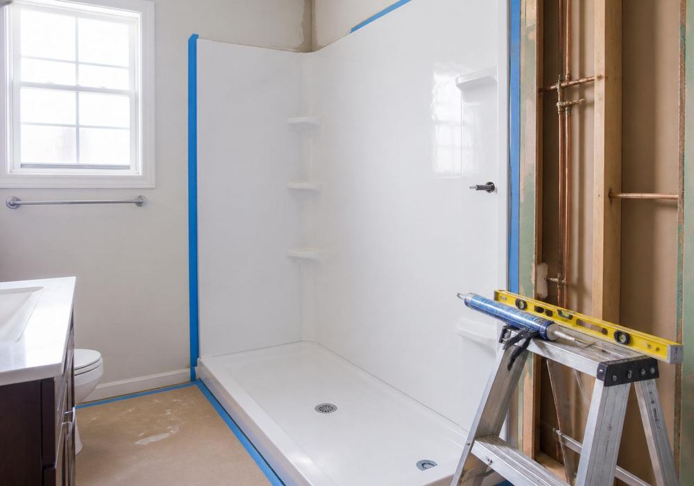Room mid-installation with fresh flooring materials staged